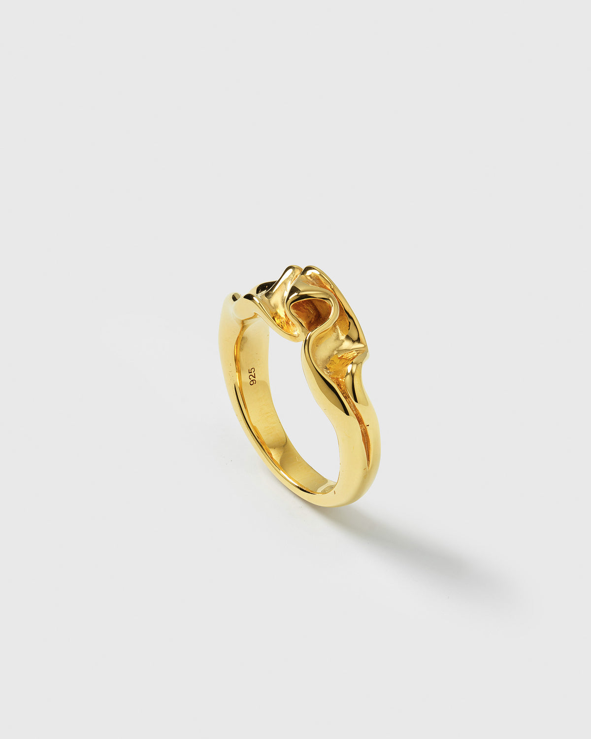 A product shot of the Moulded Narrow Ring in gold, featuring its unique and organic moulded design.