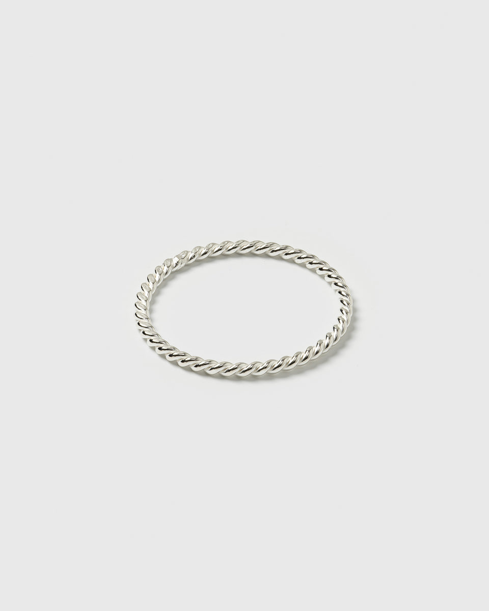 A product shot of the Tiny Twisted Ring Silver, displaying its delicate twisted design.