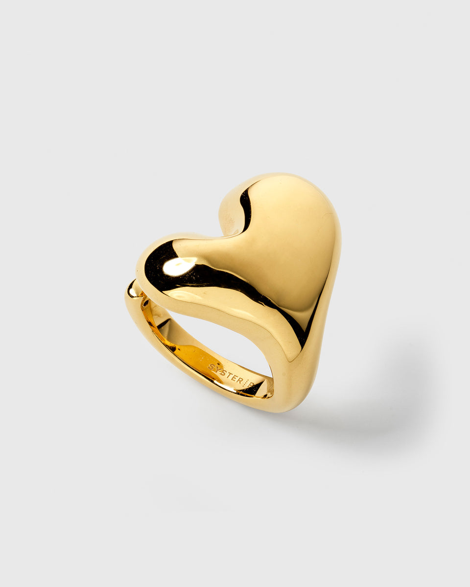 A product shot of the Bolded Heart Ring in gold, showcasing its large and voluminous heart-shaped design.