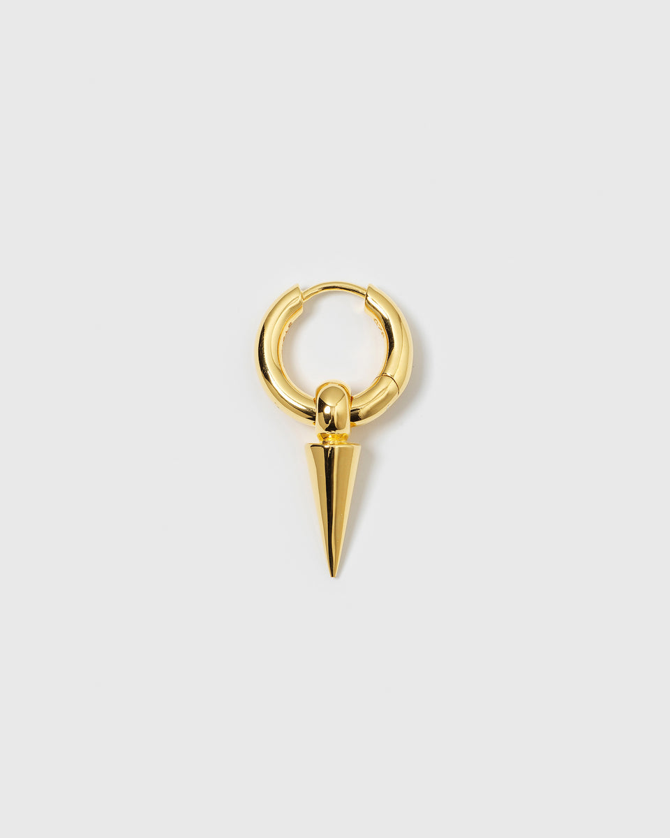 A product shot of the Juno Single Hoop in gold, featuring a thick hoop with a dangling spike charm.