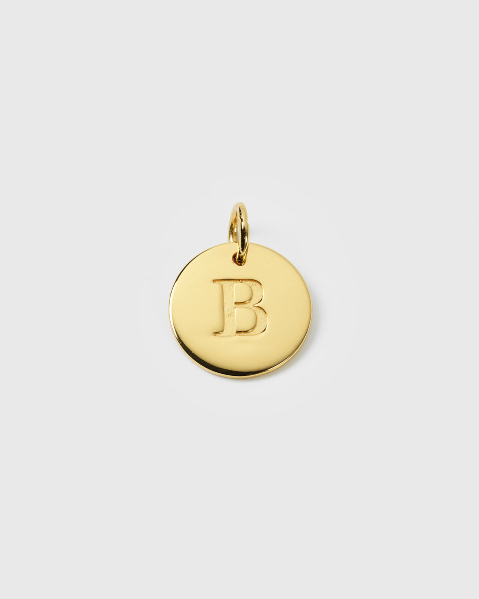 A product shot of the Beloved Big Letter Gold pendant, featuring the letter 'B' engraved on a circular gold charm.