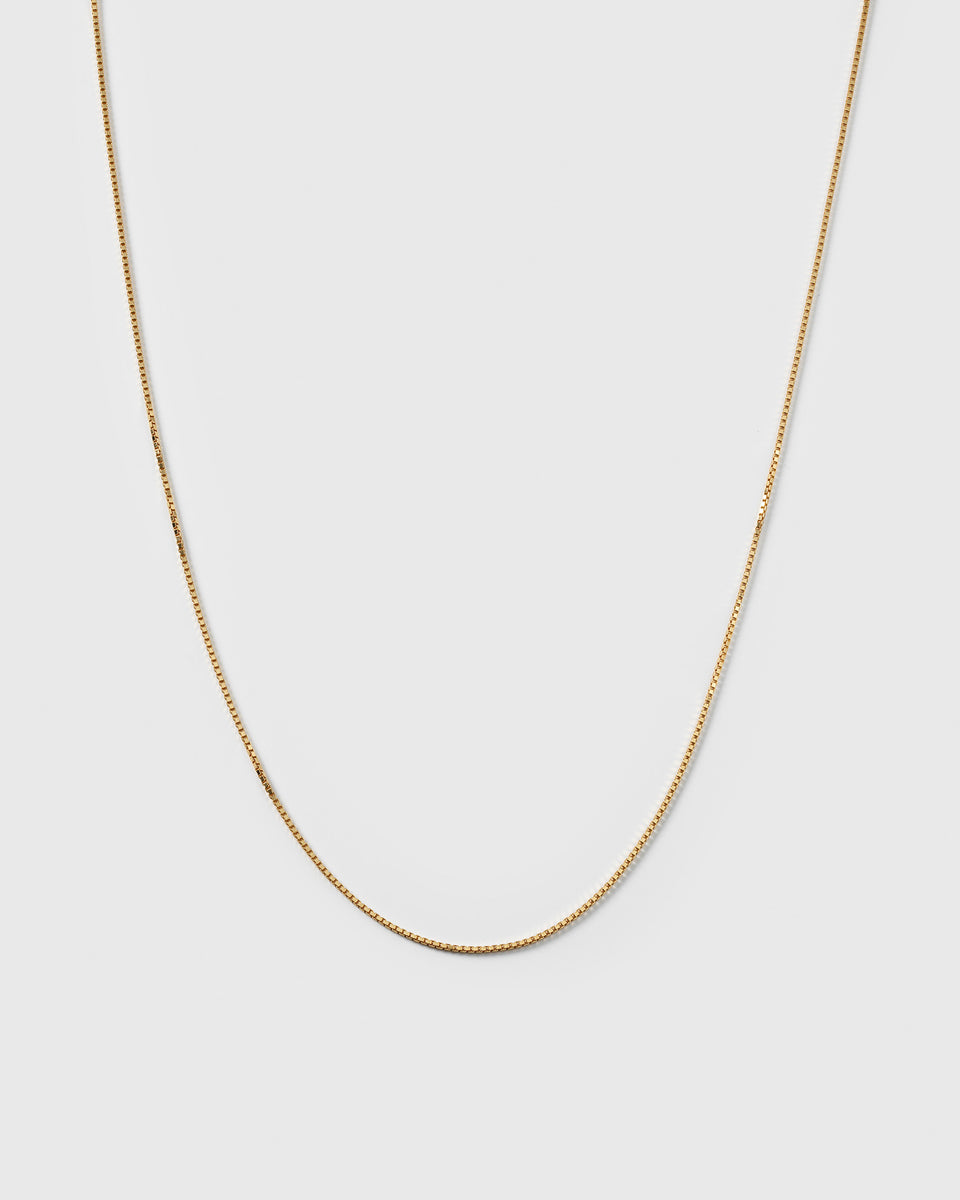 A product shot of the Beloved Medium Box Chain in gold, showcasing its delicate box link design.