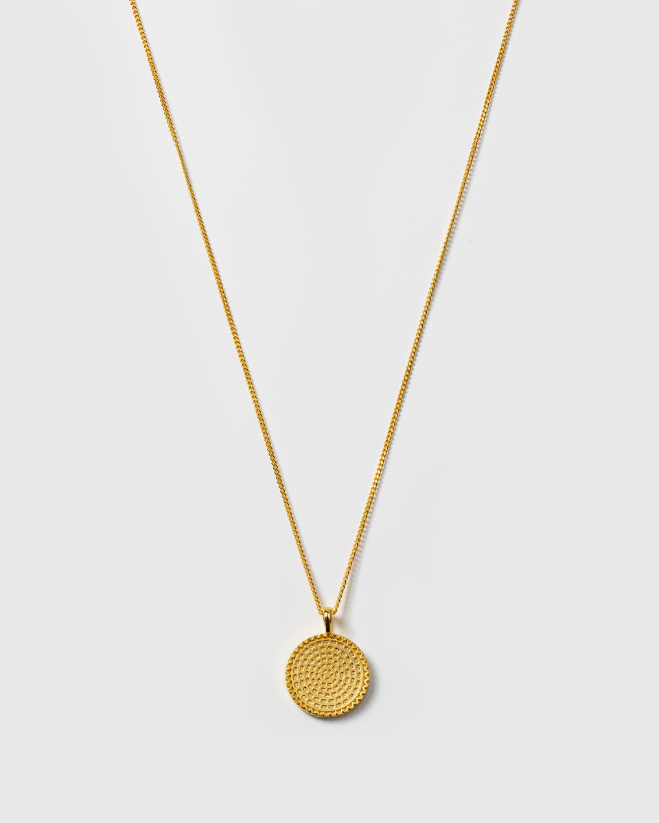 A product shot of the Lucky Coin Heal Necklace in gold, featuring a fine chain and a round pendant with an intricate sun pattern.