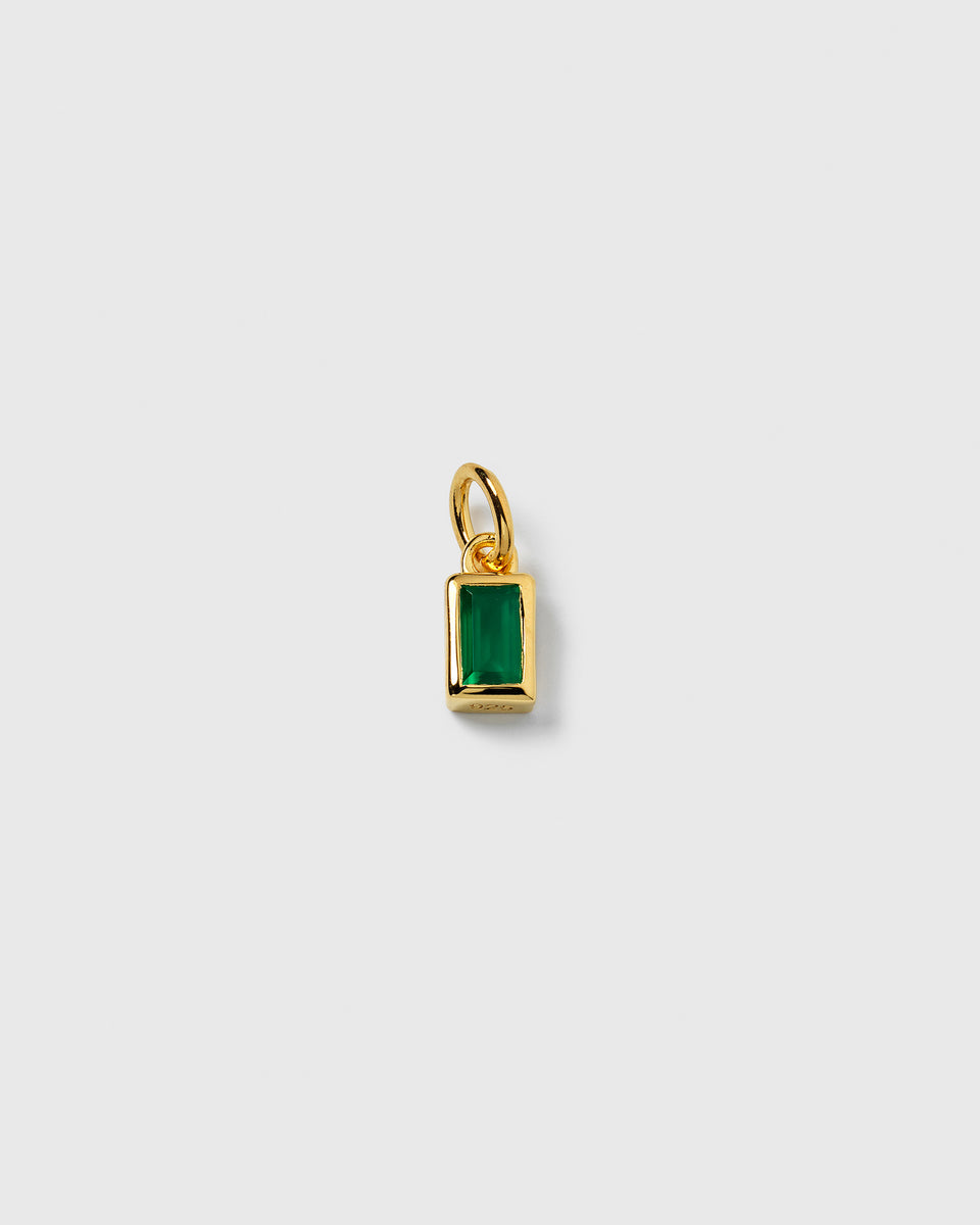A product shot of the Beloved Squared Pendant in gold, showcasing its rectangular design with a vibrant green onyx stone.