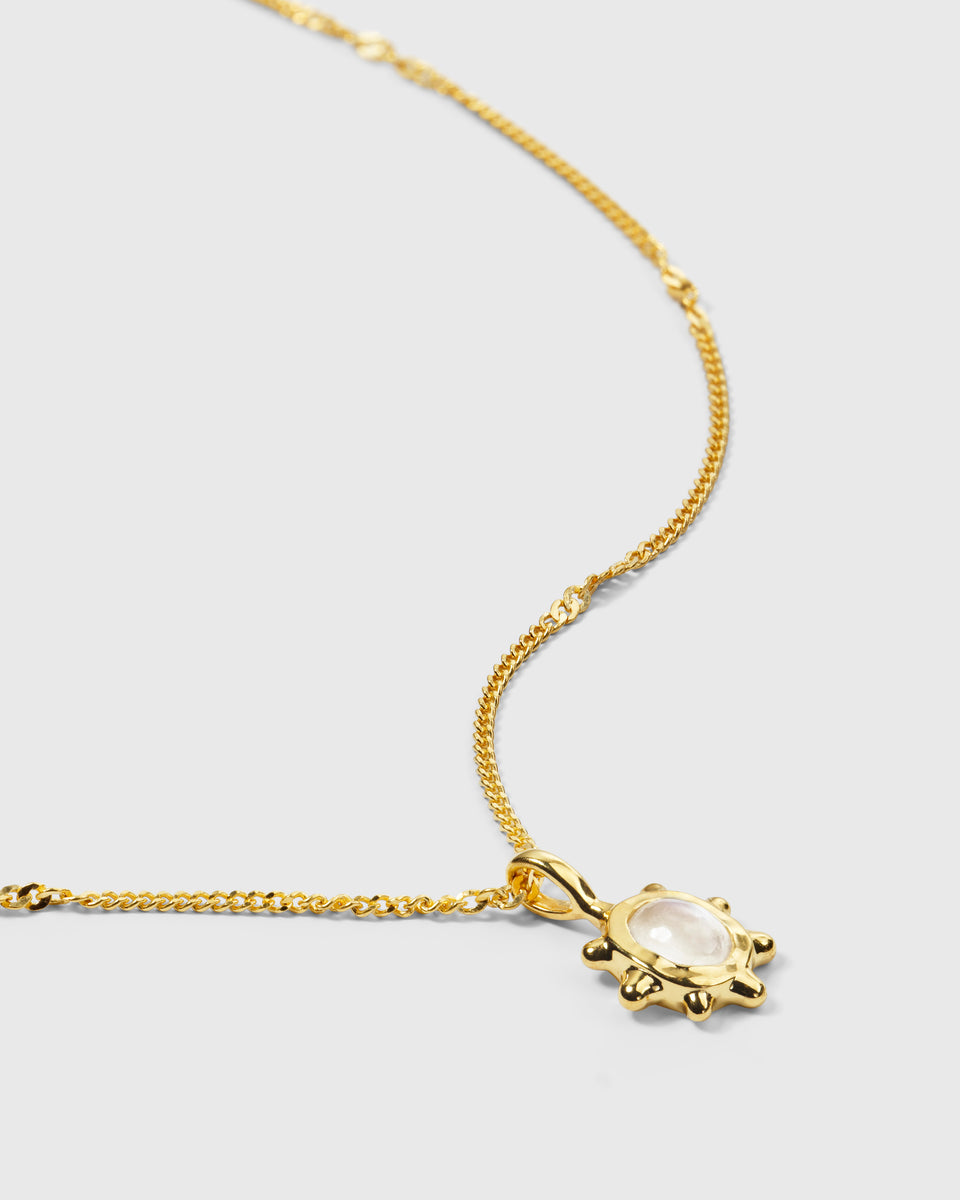 A product shot of the Florentina Necklace in gold, showcasing its delicate twisted chain and flower-shaped pendant set with a luminous moonstone.