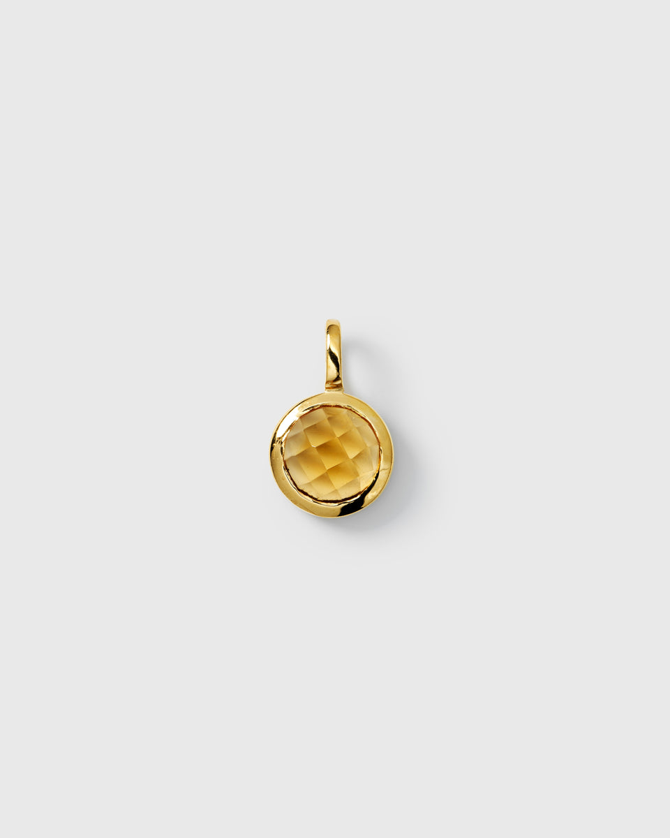Gold pendant featuring a round faceted citrine, November birthstone.