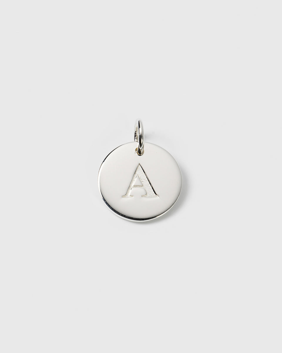 A product shot of the Beloved Big Letter Silver pendant, featuring a round silver charm with the letter 'A' engraved in the center.