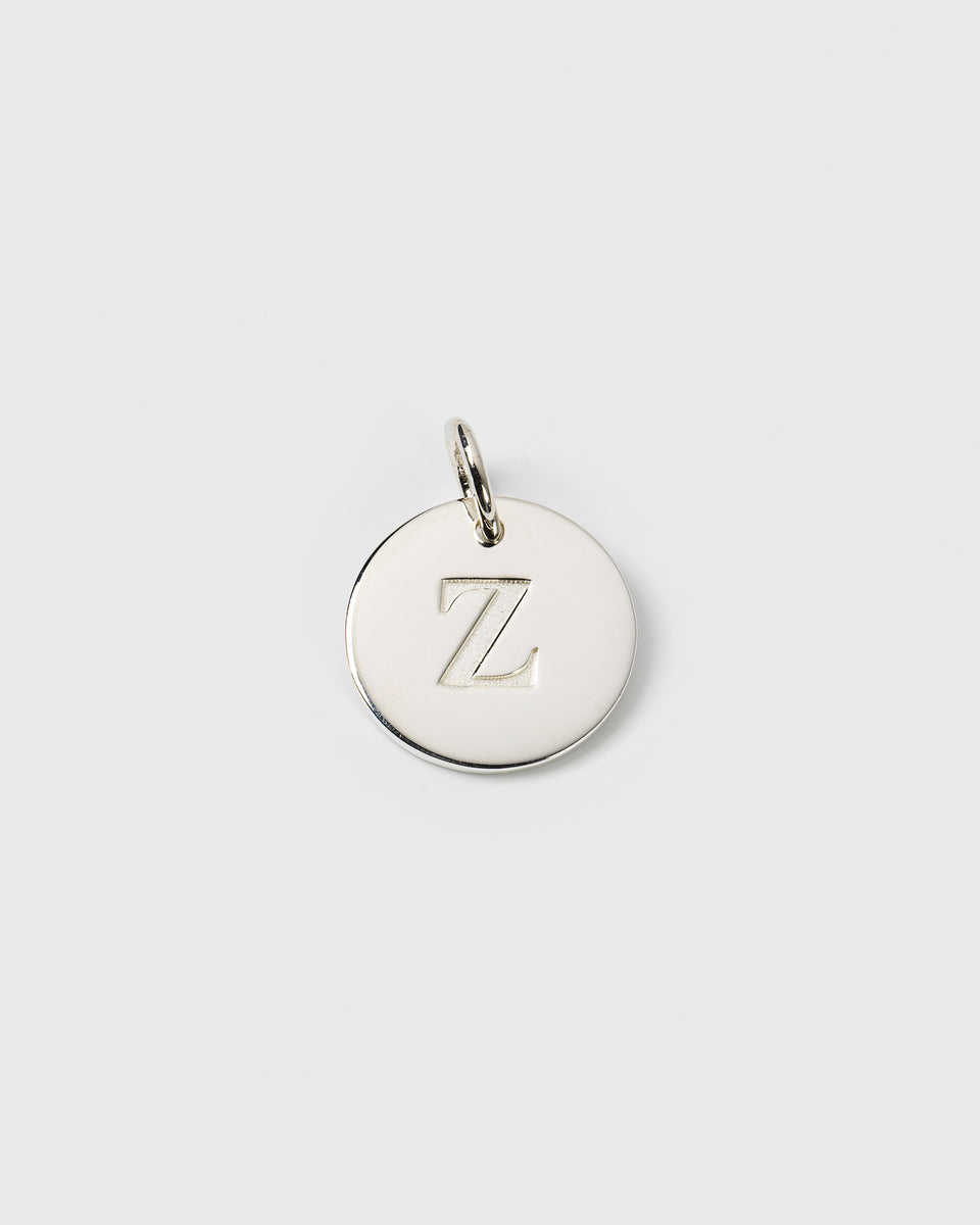 A product shot of the Beloved Big Letter charm in silver, featuring a circular pendant with the letter Z engraved on the front.