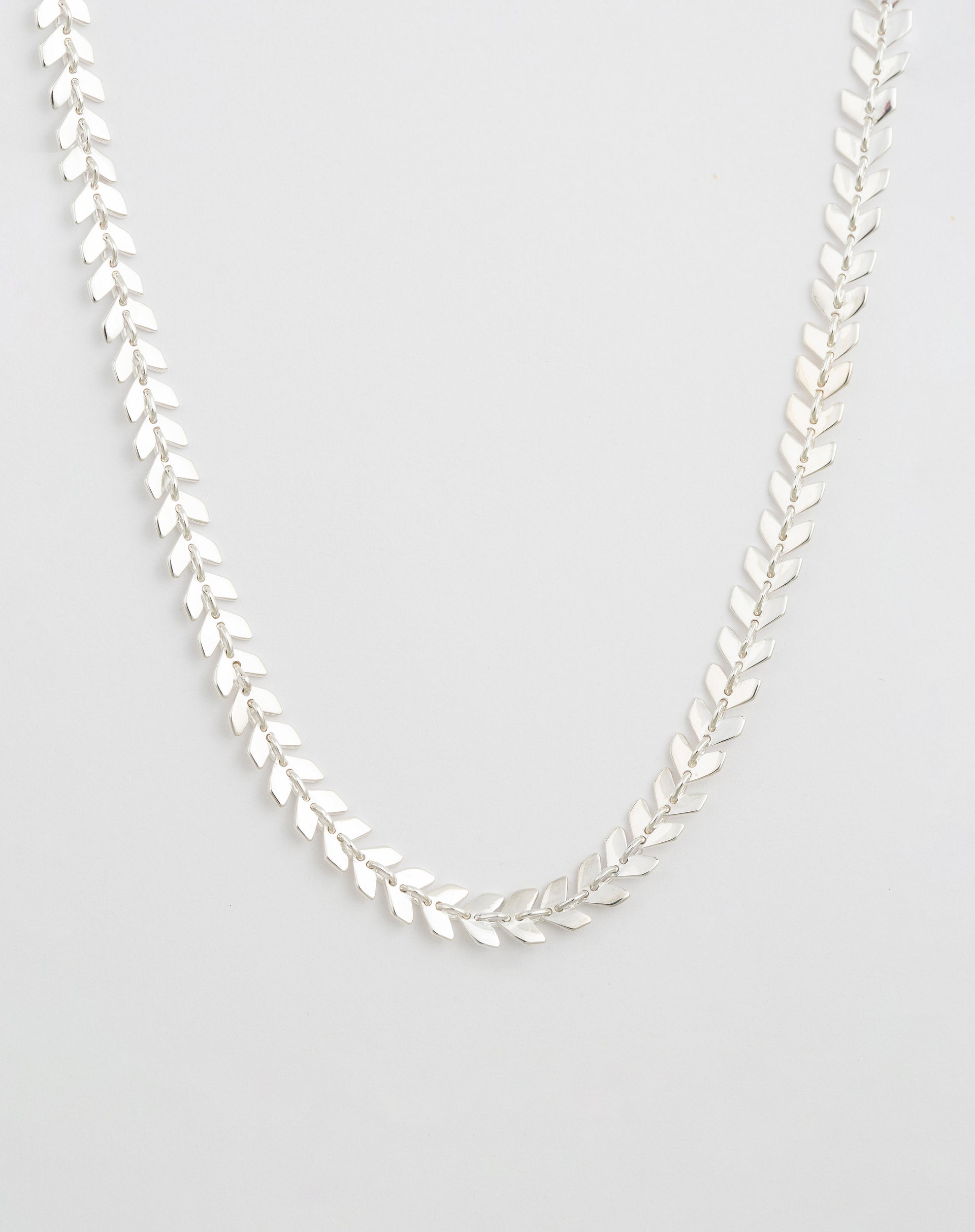 Silver necklace with small leaf-like parts