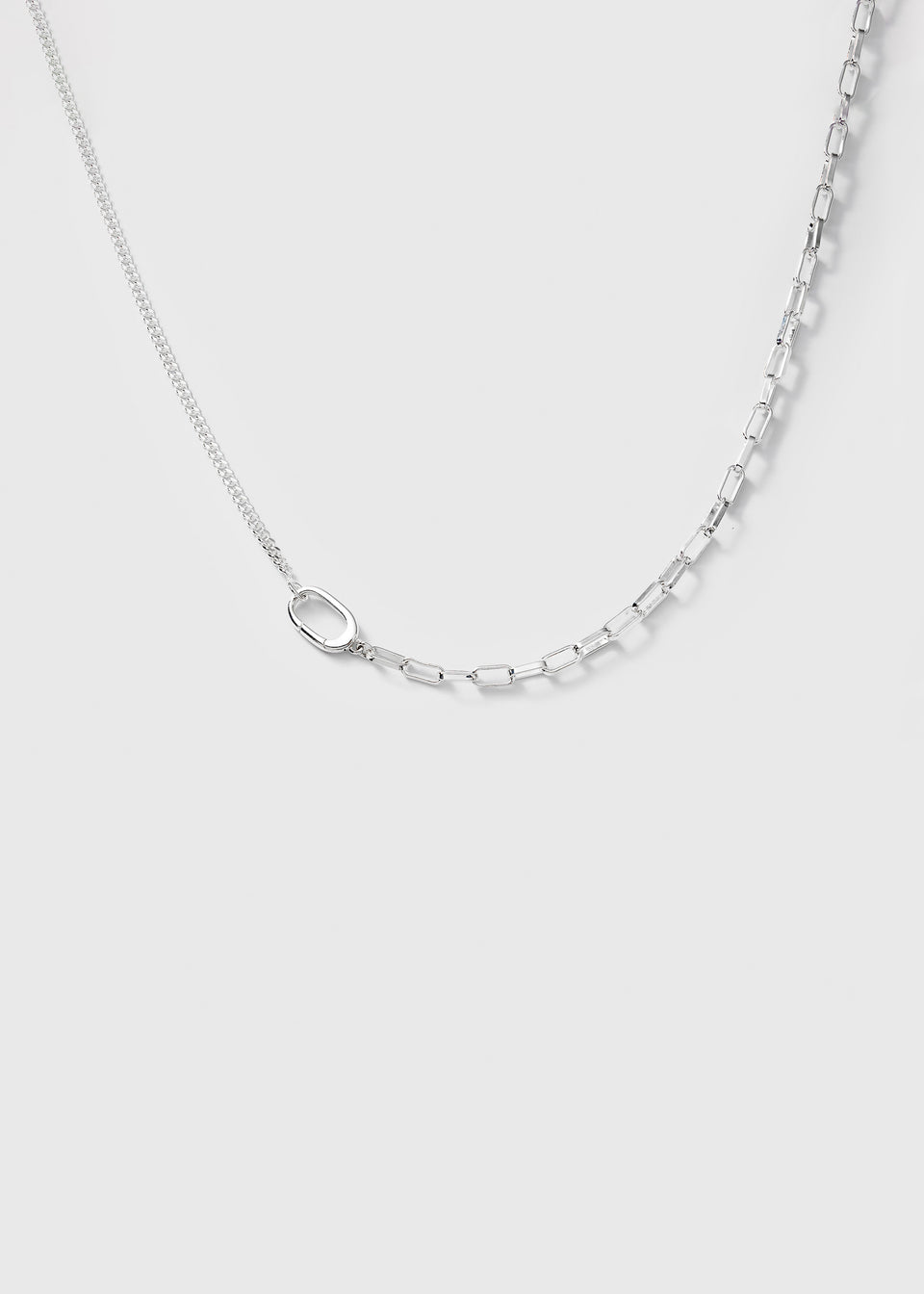 A product shot of the Harvey Heavy Necklace in silver, highlighting its unique design of two combined chains: one fine and one with heavy rectangular links.