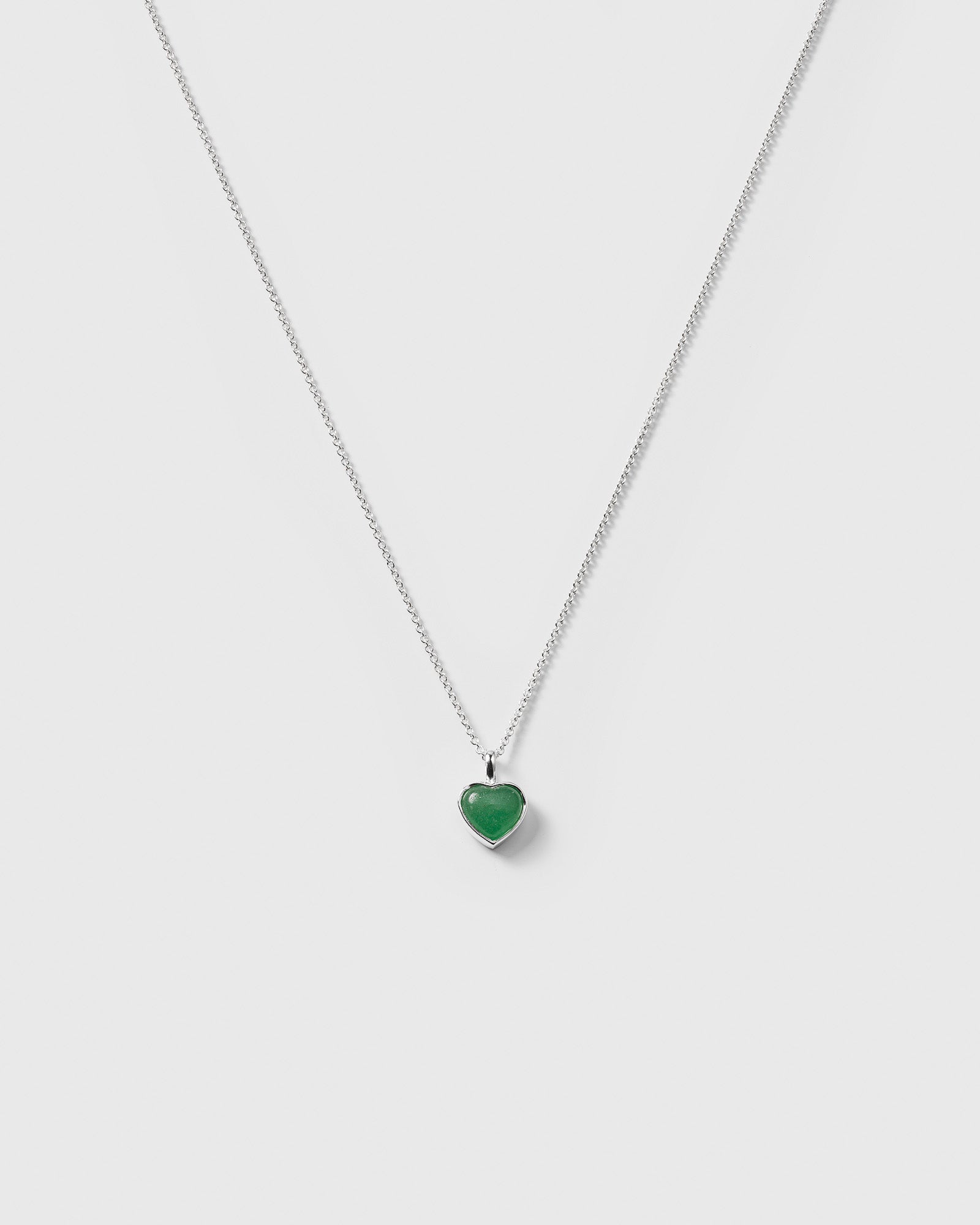 The La La Love Necklace in recycled sterling silver, featuring a delicate chain and a heart-shaped green jade pendant.