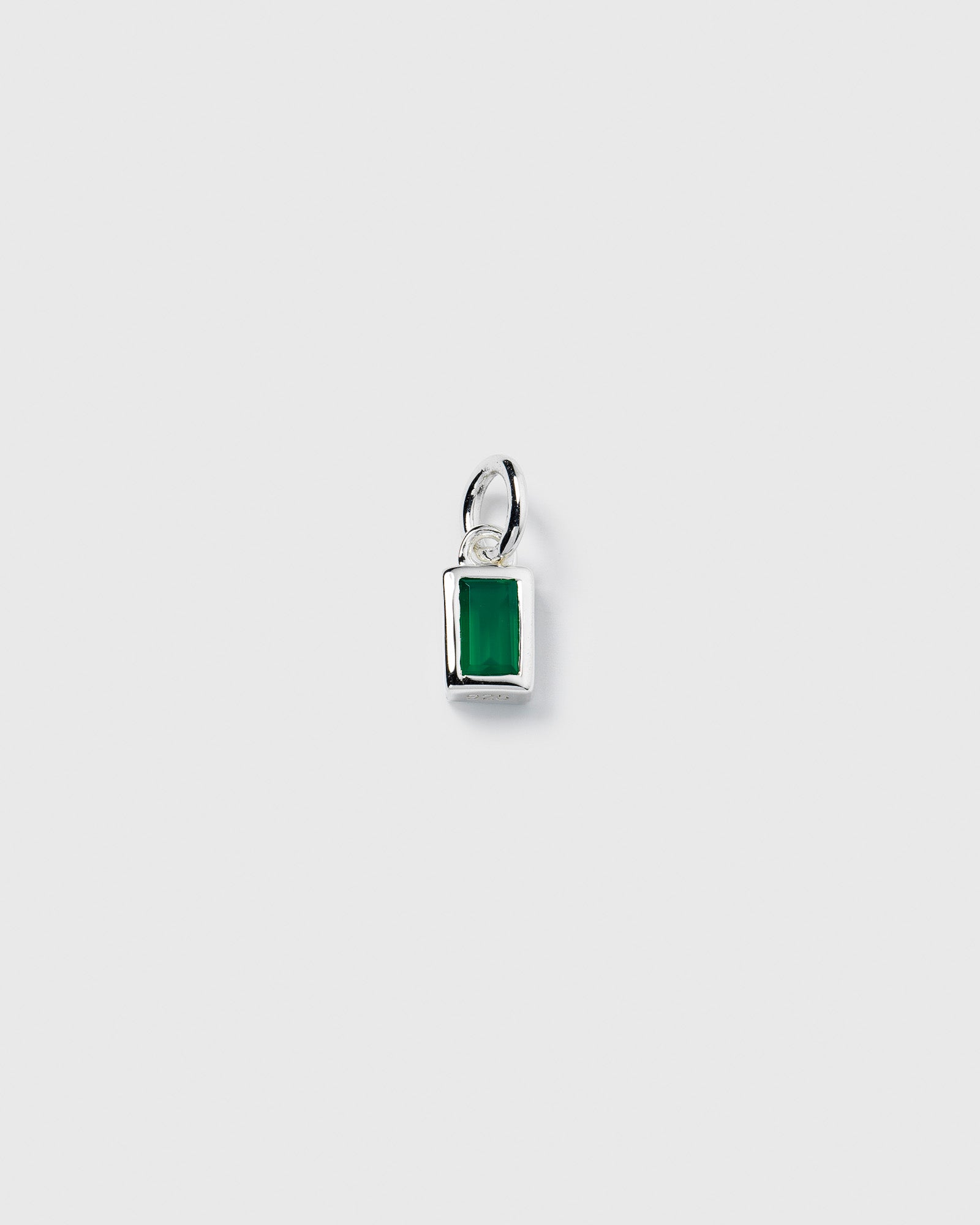 A product shot of the Beloved Squared Pendant in silver, a small rectangular charm featuring a vibrant green onyx stone.