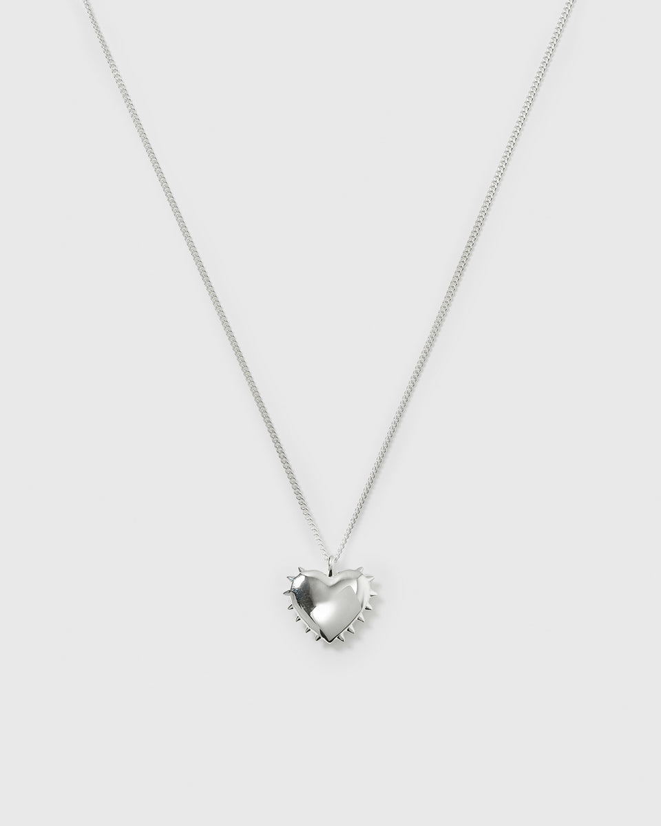 A product shot of the True Love Spike Heart Necklace in silver, showcasing the link chain and the puffy heart pendant adorned with small spikes.