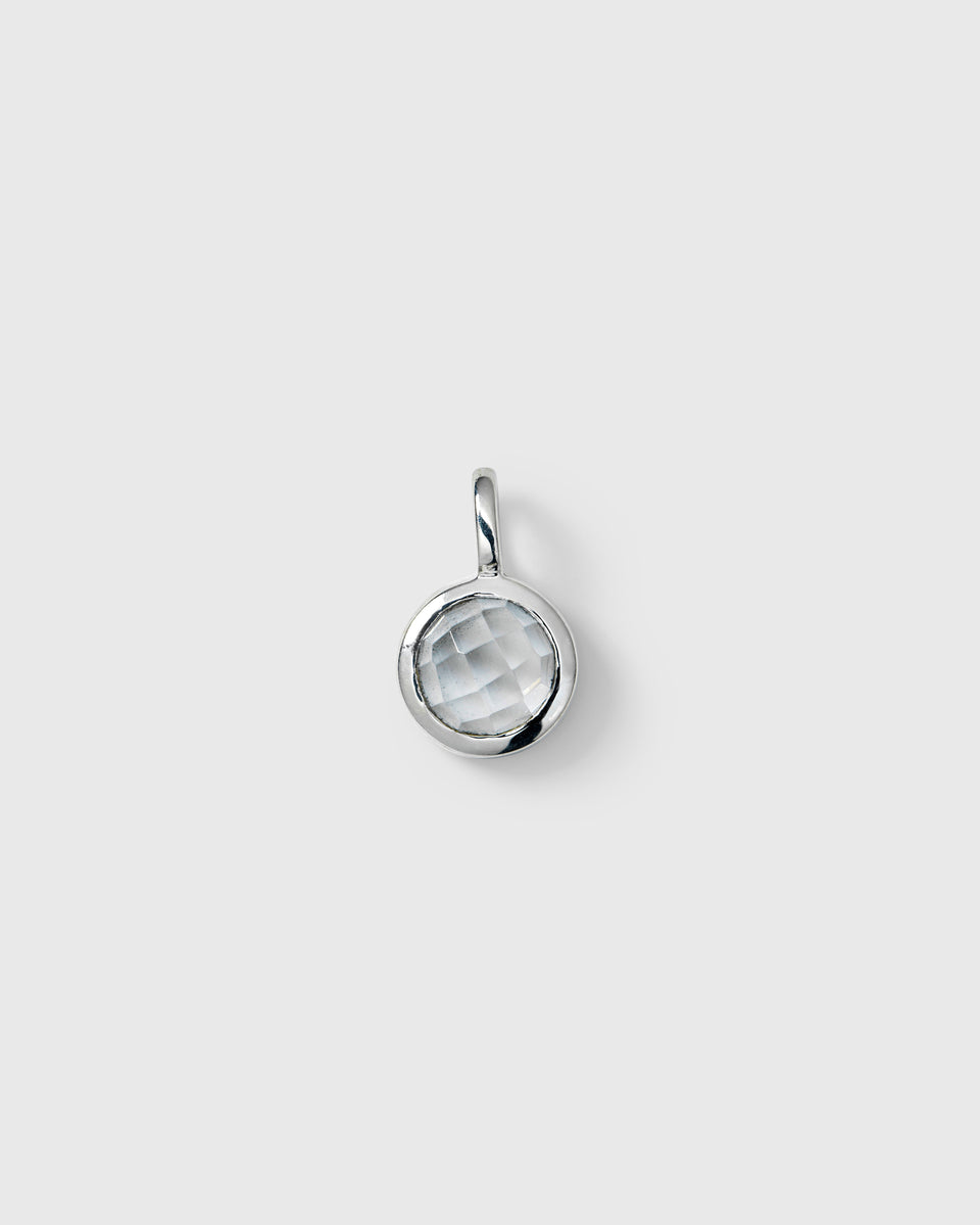 Silver pendant featuring a round faceted white topaz, April birthstone.