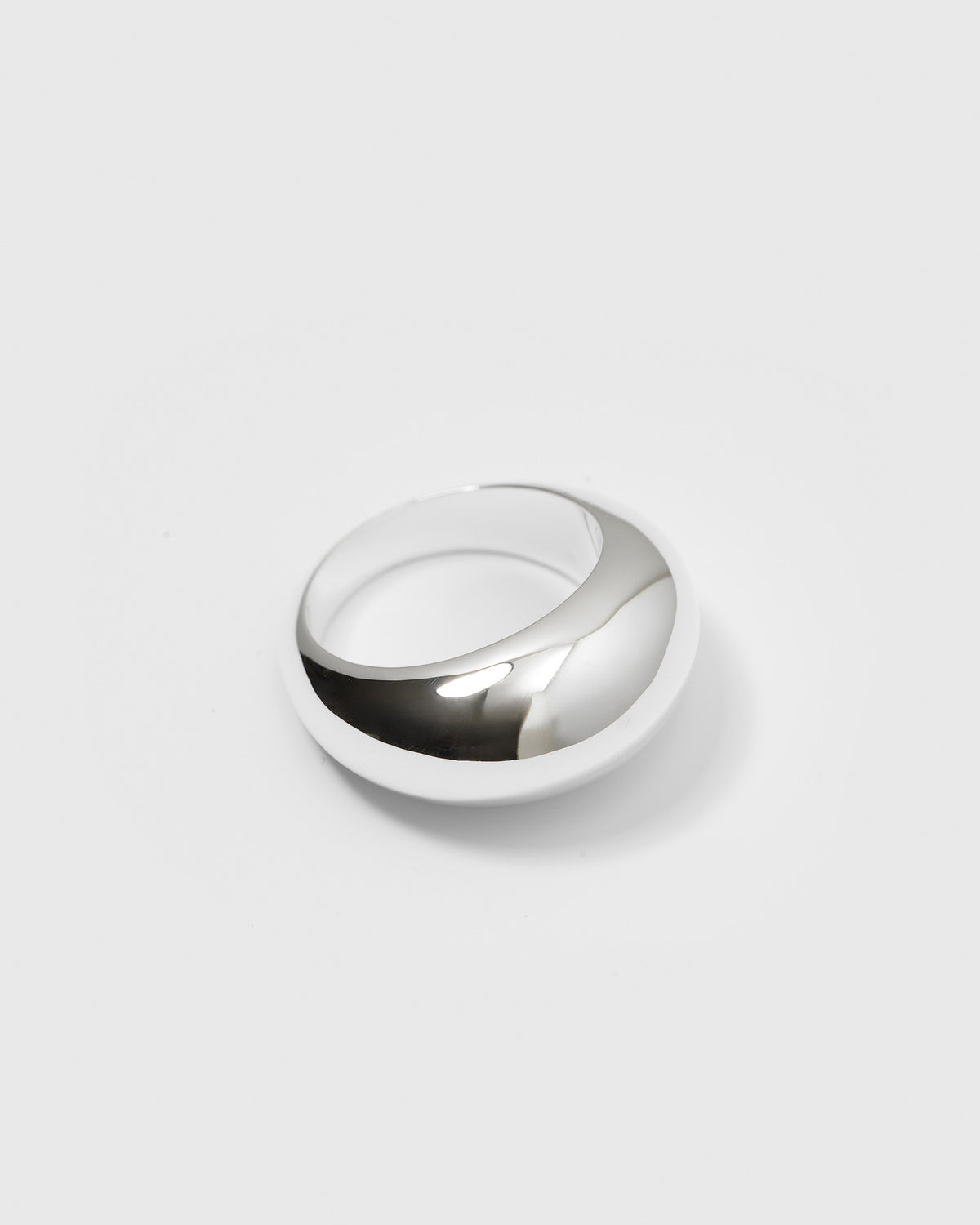 A product shot of the Bolded Big Ring Silver, showcasing its wide, polished, and rounded design.