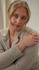 A video of a model wearing the Darling Bracelet Silver, featuring a chain of connected hearts.