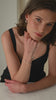 A close-up video of a model wearing the Strict Bar Bangle in silver on her wrist.